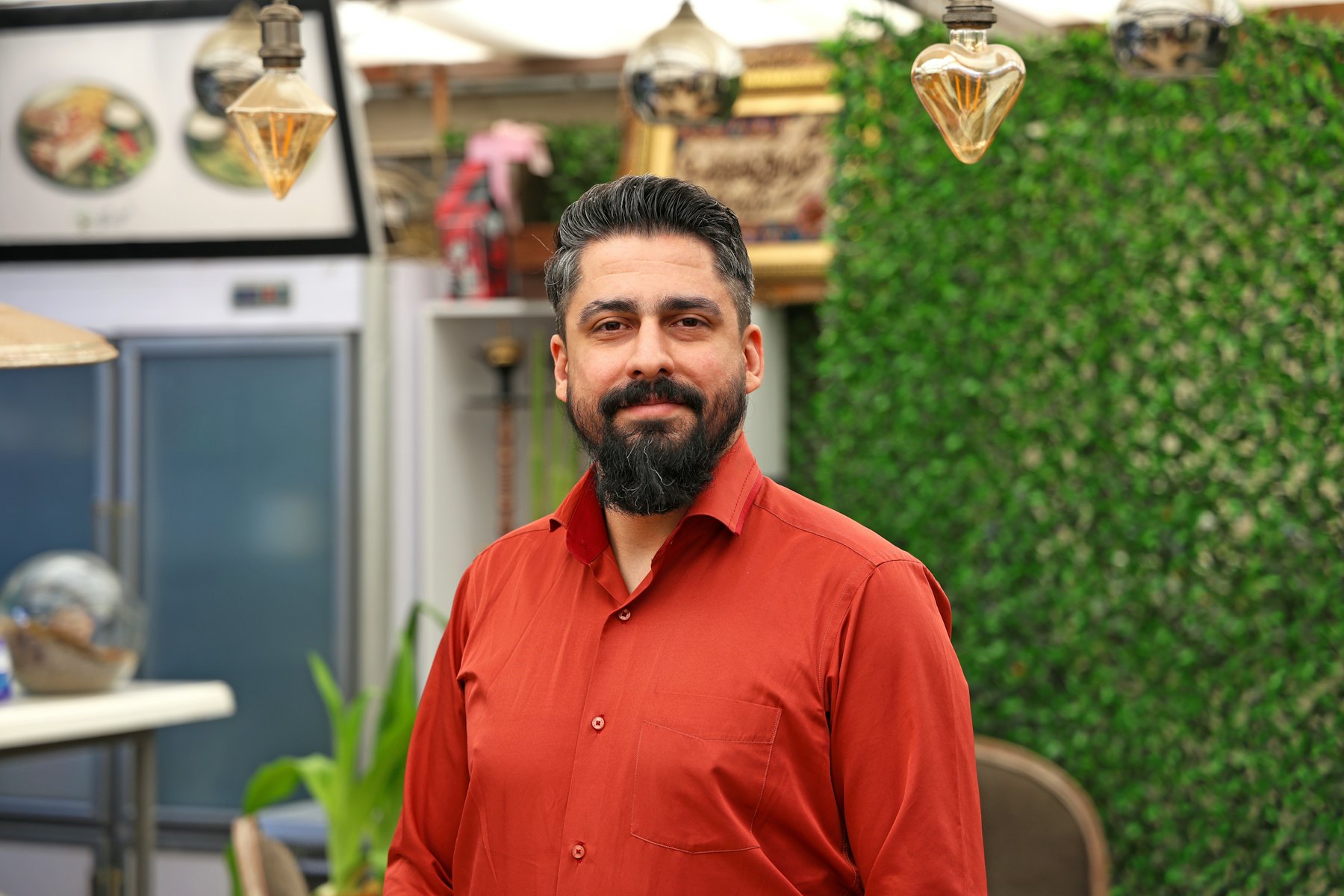 Smiling business owner in his shop