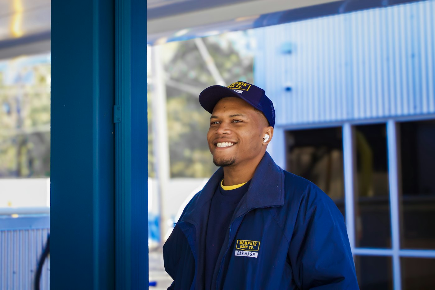 Service technician in uniform outside a building